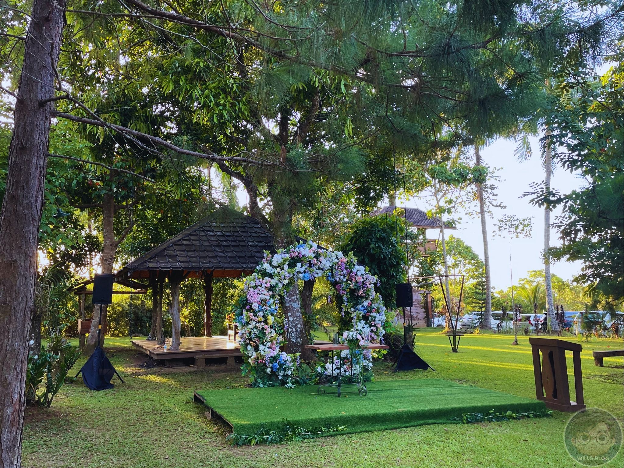 A garden altar dressed in flowers and golden afternoon light.